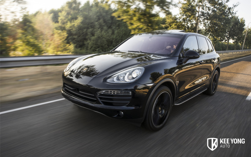Porsche Car Cruising Down The Road
